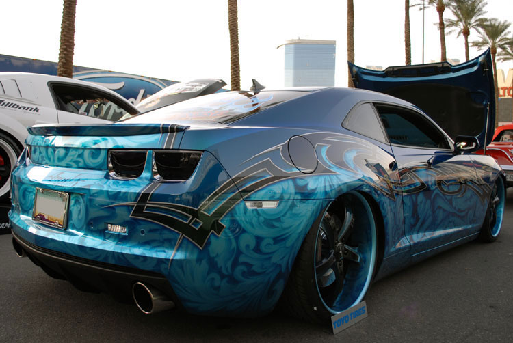 This Camaro SS combines tribal designs with ghost like images on a bright 