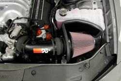 The air filter and heat shield install in the original location of the factory air box