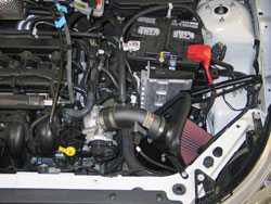 The heat shield and filter are designed to be located in the original air box space