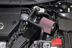 The heat shield used in the 2013-2016 Nissan Altima K&N air intake system uses and adaptor to retain the stock air ducting which routes cold air toward the intake