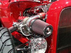 A universal K&N Filter peeking over the headlights on the 1932 Ford during 2012 SEMA Show