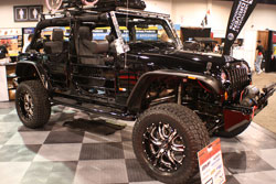 A K&N air filter sits underneath the hood of this 2012 Jeep Wrangler that was dsiplayed at the 2012 SEMA Show