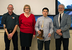 Calvin Ha of Mark Keppel High School accepts the Alhambra Outstanding Student Award, California State Recognition, and a $500 scholarship from K&N