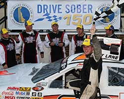 Austin Hill waives the checkered flag as he and the Hill Brothers Racing Team celebrates back to back wins at both Dover International Speedway and the NASCAR K&N Pro Series East