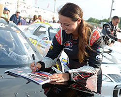 Kenzie Ruston, seen here signing autographs, drove her Ben Kennedy Racing Chevy to a third place finish making her the highest finishing female driver in NASCAR K&N Pro Series East history