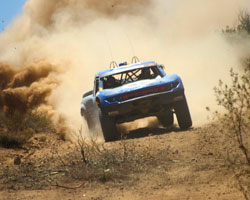 A chase vehicle helped the Red Bull Trophy Truck of Menzies Motorsports get back into the Baja 500 race and regain a lost position