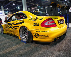 The Sarto Racing Rocket Bunny wide body kit, APR Performance carbon fiber wing, front & side splitters, and the competition yellow livery made this car pop at the 2015 SEMA Show