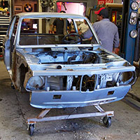 Restoration of the Clarion Builds 1974 BMW 2002 is already underway with a complete tear down as the first task followed by extensive rust repair