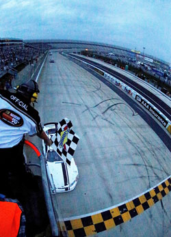 Cory LaJoie takes the checkered flag after having black flag threats during the race at Dover International Speedway