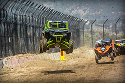 Brad Deberti jumps with his Pro Production Polaris RZR at Lucas Oil Off Road Series