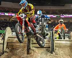 Even unnatural obstacles, such as these wooden spools, are used in an AMA EnduroCross fueled by Monster Energy course