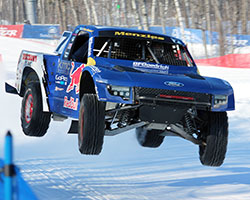 The trucks are equipped with one-off spiked tires specifically made for the Red Bull Frozen Rush