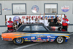 Greg (fourth from right) and crew celebrate the win at Fontana last spring, after going seven rounds to win the Super Street class in the Chevy II he built more than 20 years ago with his father.