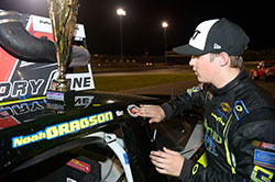 Noah Gragson puts a Race Winner Decal on his car after winning the NASCAR K&N Pro Series East race at Stafford Speedway in Connecticut.