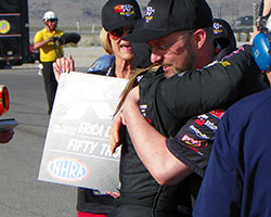 Frank Savarese and Erica Ender-Stevens traded a hug as she stepped out of the car following her second NHRA K&N Horsepower Challenge victory