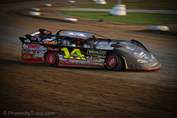 Tyler Clem making the wide turn in his #14 Late Model racecar.