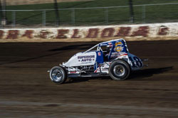 Sprint car driver Jarett Adretti zooms by at the USAC race