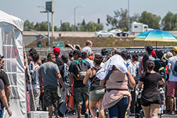 Fans walking around Auto Enthusiast Day in Anaheim, Ca