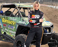 Katie Vernola modeling in front of her Polaris RZR 900