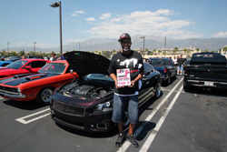 Sean Sheppard showing off his win for his 2010 Nissan Maxima