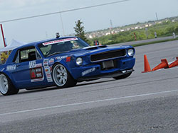 Mike Maier driving his 1966 Ford Mustang at Circuit of the Americas