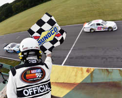Sergio Pena and Kaz Grala at the finish line of the NASCAR K&N Pro Series East Biscuitville 125.