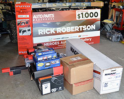 Retired U.S. Army Sergeant Rick Robertson was presented with a gift certificate and a stack of parts from companies like K&N for his 2005 Dodge Ram 1500 SLT 4x4