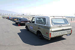 Vehicles waiting to compete on the road course at Auto Club Speedway in Fontana, California