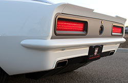 A custom fabricated rear valance, custom integrated rear spoiler, and custom built rear bumper tidy up the backside of this 1967 Chevy Camaro built by EBMC and named Snowblind