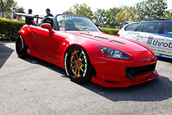 Red with gold wheels on a S2K at Shutter Space Randy Higbee Gallery, Costa Mesa, California sponsored by Crooks & Castles and Super Street