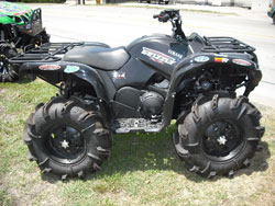 Tejas Motorsports custom Yamaha Grizzly ATV with large mud tires and a K&N air filter.