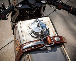The Track Chief’s gas tank was handmade from titanium, capped off with a custom gas cap, stainless steel tank strap buckles, and a leather tank strap complete with Indian Head Nickel