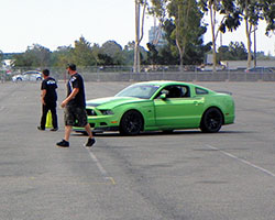 Vaughn Gittin Jr was busy setting up and testing the drift course in his Ford Mustang RTR street car before the Auto Enthusiast Day presented by Nitto Tire was officially underway