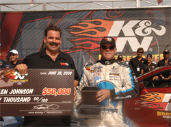 K&N Vice President of Research and Development Steve Williams presents $50,000 to Pro Stock driver Allen Johnson who won the 2008 K&N Horsepower Challenge