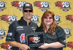 K&N's Tamra Bradley presents Greg Anderson with K&N Horsepower Challenge low qualifier award at Bandimere Speedway