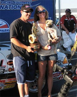 Rick Baehr, wife Sarah Baehr and dog Sasha after his first NHRA National Event win