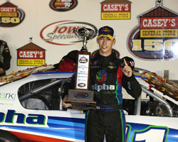 Ben Rhodes accepts the first place trophy for his NASCAR K&N Pro Series win in the Casey’s General Store 150 at Iowa Speedway