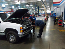 Students at Universal Technical Institute perform maintenance and repair work on the Million Mile Truck.