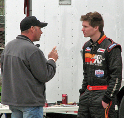 Cody Swanson receives tips from coach Tim Clauson in DMS Driver Challenge at Madera Speedway