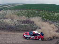 Andrew Comrie-Picard drives his Mitsubishi Lancer Evolution 1X at Olympus 
Rally, photo by Warick Patterson/Flatovercrest.com