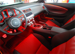 2010 Camaro's interior features seem to glow from accent lighting and placement of red LED lights