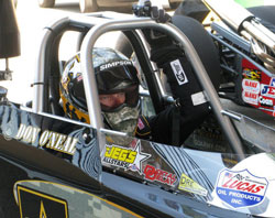 Nothing but pure focus and determination in the eyes of Don O'Neal behind the wheel of his Army/K&N dragster.