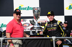 Dylan Kwasniewski and George Silbermann, NASCAR Vice President, in the Victory Land at Road Atlanta