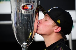 Dylan Kwasniewski and the NASCAR K&N Pro Series East championship trophy