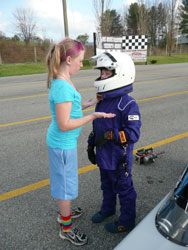 Veteran JR racer Madilyn, giving some last minute advice to the newest drag racer in the family, Adiayn.