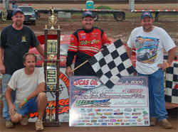 Brasstown, North Carolina Native Ray Cook celebrates big payday with his crew after winning the 100 lap Hillbilly Hundred, photo by Todd Turner