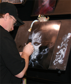 Mike Lavallee demonstrates air brush art in the House of Kolor Booth at the SEMA Show in Las Vegas, Nevada
