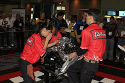 Students are in a race against the clock and also the other team to correctly disassemble the engine.