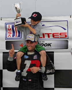 Primetime Team owner and driver Joel Feinberg and son Peter on the podium at Sebring International Raceway