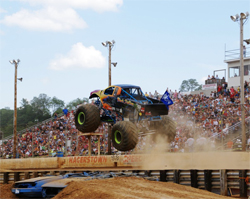 Black Stallion monster truck weighs about 10,000 pounds but still jumps high in front of a packed stadium